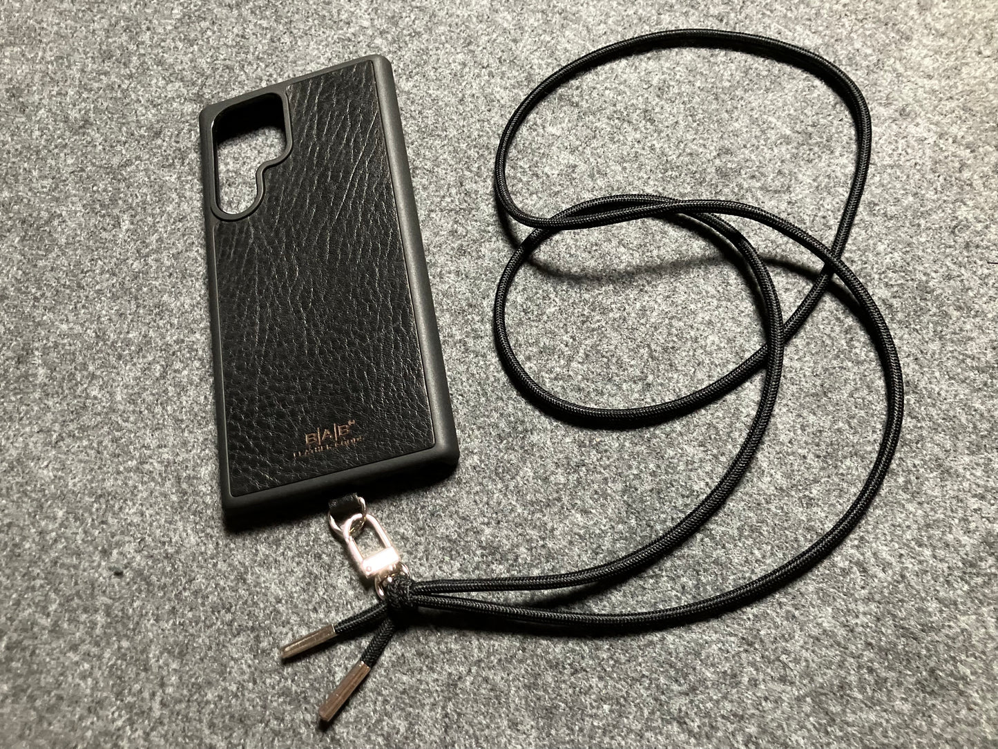 Samsung Case/Holder, Laser Cut & Engraved Full-Grain vegetable-tanned Genuine Leather/microfiber & Black Elastic Rope Crossbody/Necklace/Choker/Bracelet with a Carabiner, and 2 Silver End caps.- KCS53