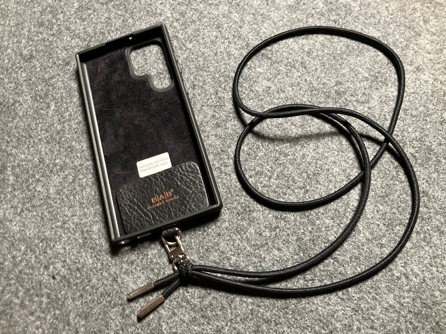 Samsung Case/Holder, Laser Cut & Engraved Full-Grain vegetable-tanned Genuine Leather/microfiber & Black Elastic Rope Crossbody/Necklace/Choker/Bracelet with a Carabiner, and 2 Silver End caps.- KCS53