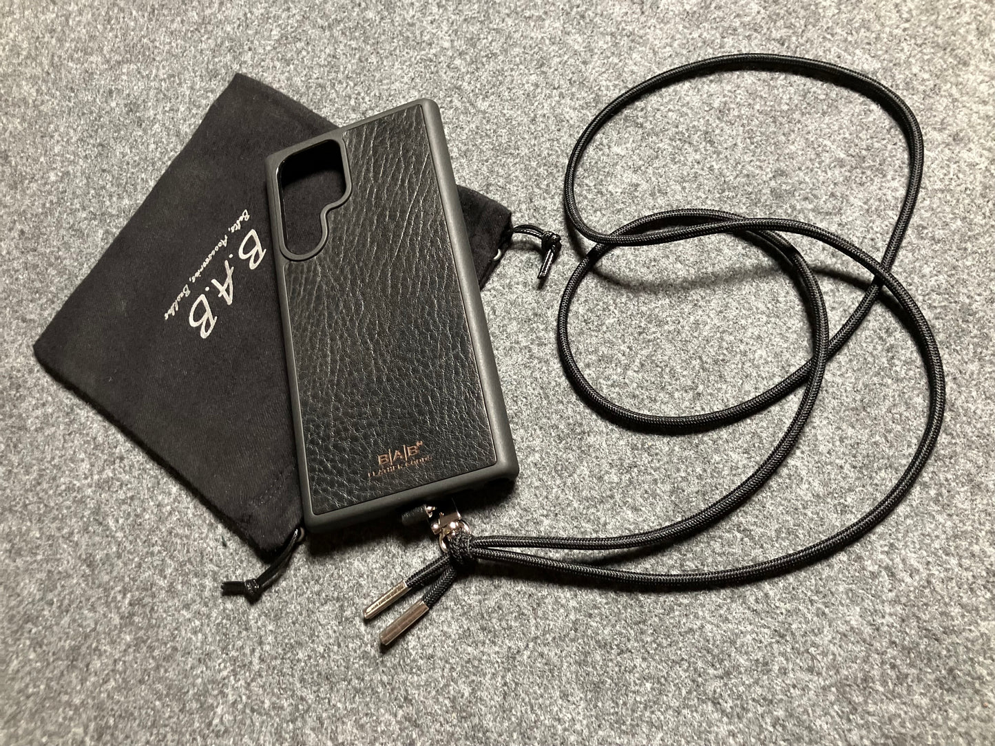 Samsung Case/Holder, Laser Cut & Engraved Full-Grain vegetable-tanned Genuine Leather/microfiber & Black Elastic Rope Crossbody/Necklace/Choker/Bracelet with a Carabiner, and 2 Silver End caps.- KCS53
