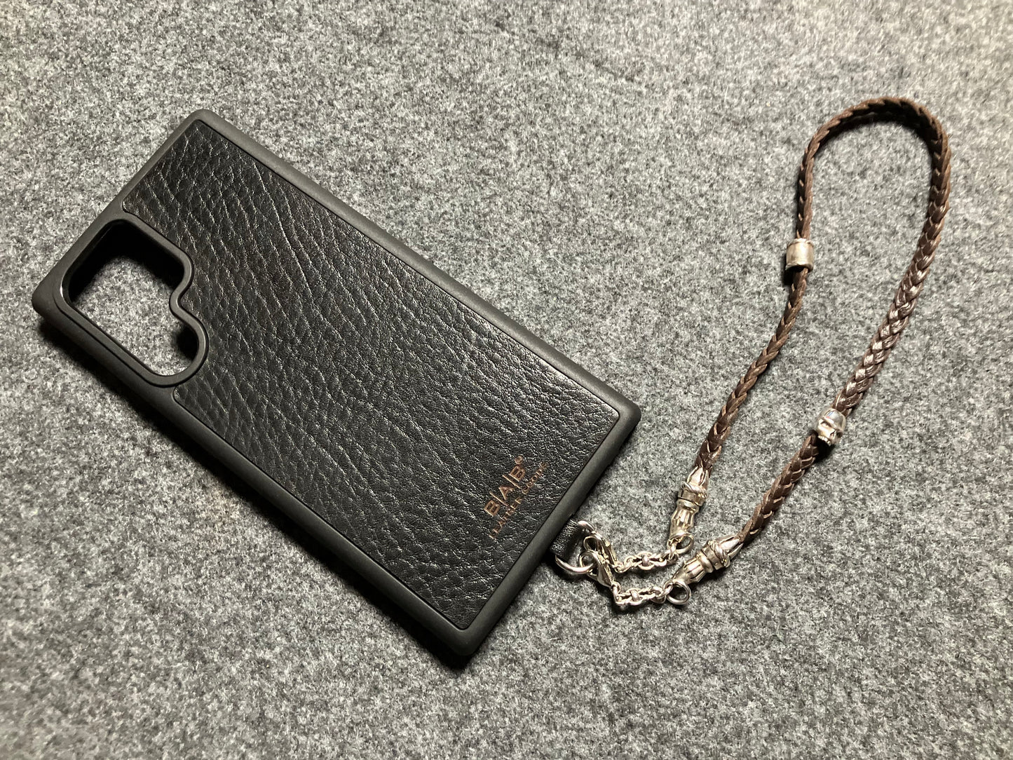 Full-Grain Genuine Leather Laser-cut & engraved Samsung Case/Holder/microfiber & 2 Terminals & 1 Rope Pin, 1 Skull, and 6 Rings, all made of 925 Sterling Silver & Strap/Choker/Bracelet, hand-braided 3-strands Leather, Brown or Black.- KP03S