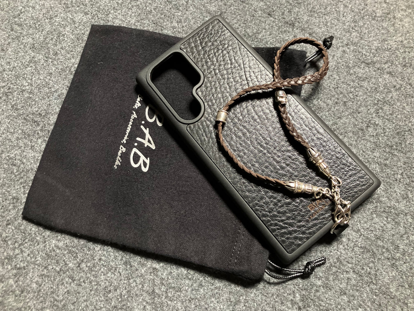 Full-Grain Genuine Leather Laser-cut & engraved Samsung Case/Holder/microfiber & 2 Terminals & 1 Rope Pin, 1 Skull, and 6 Rings, all made of 925 Sterling Silver & Strap/Choker/Bracelet, hand-braided 3-strands Leather, Brown or Black.- KP03S