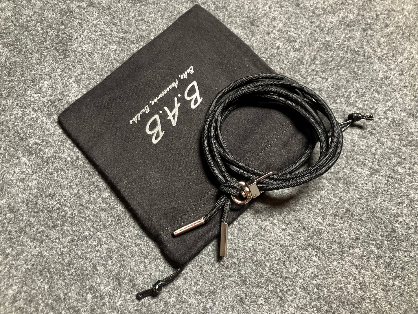 Samsung Case/Holder, Laser Cut & Engraved Full-Grain vegetable-tanned Genuine Leather/microfiber & Black Elastic Rope Crossbody/Necklace/Choker/Bracelet with a Carabiner, and 2 Silver End caps.- KCS53