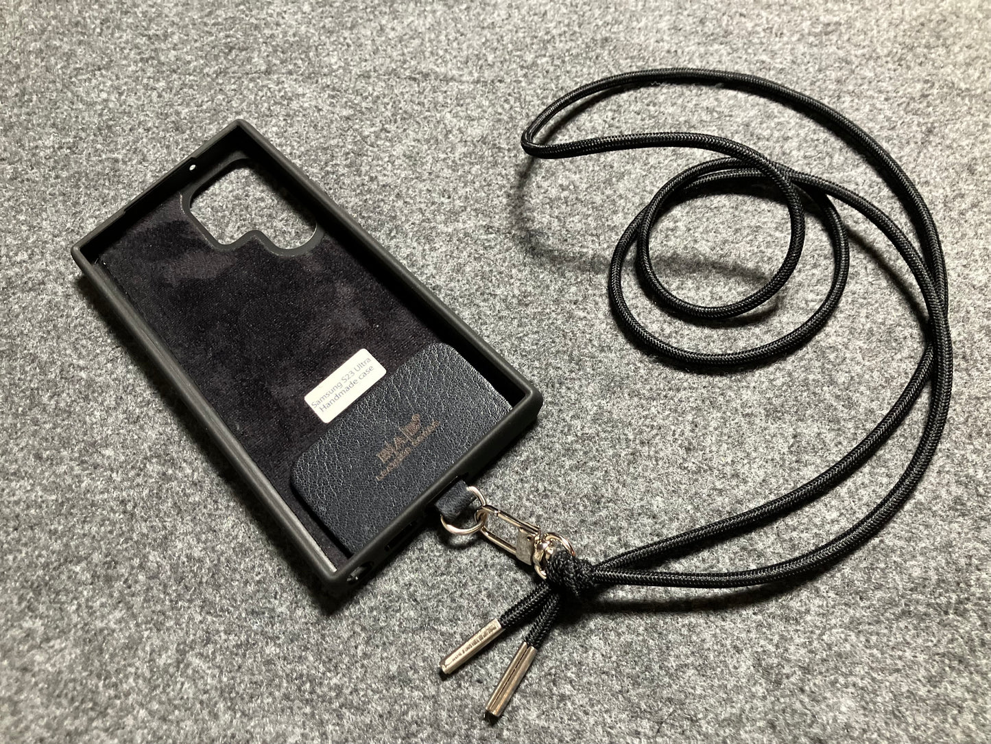 Samsung Case/Holder, Laser Cut & Engraved Full-Grain vegetable-tanned Genuine Leather/microfiber & Black Elastic Rope Crossbody/Necklace/Choker/Bracelet with a Carabiner, and 2 Silver End caps.- KCS53