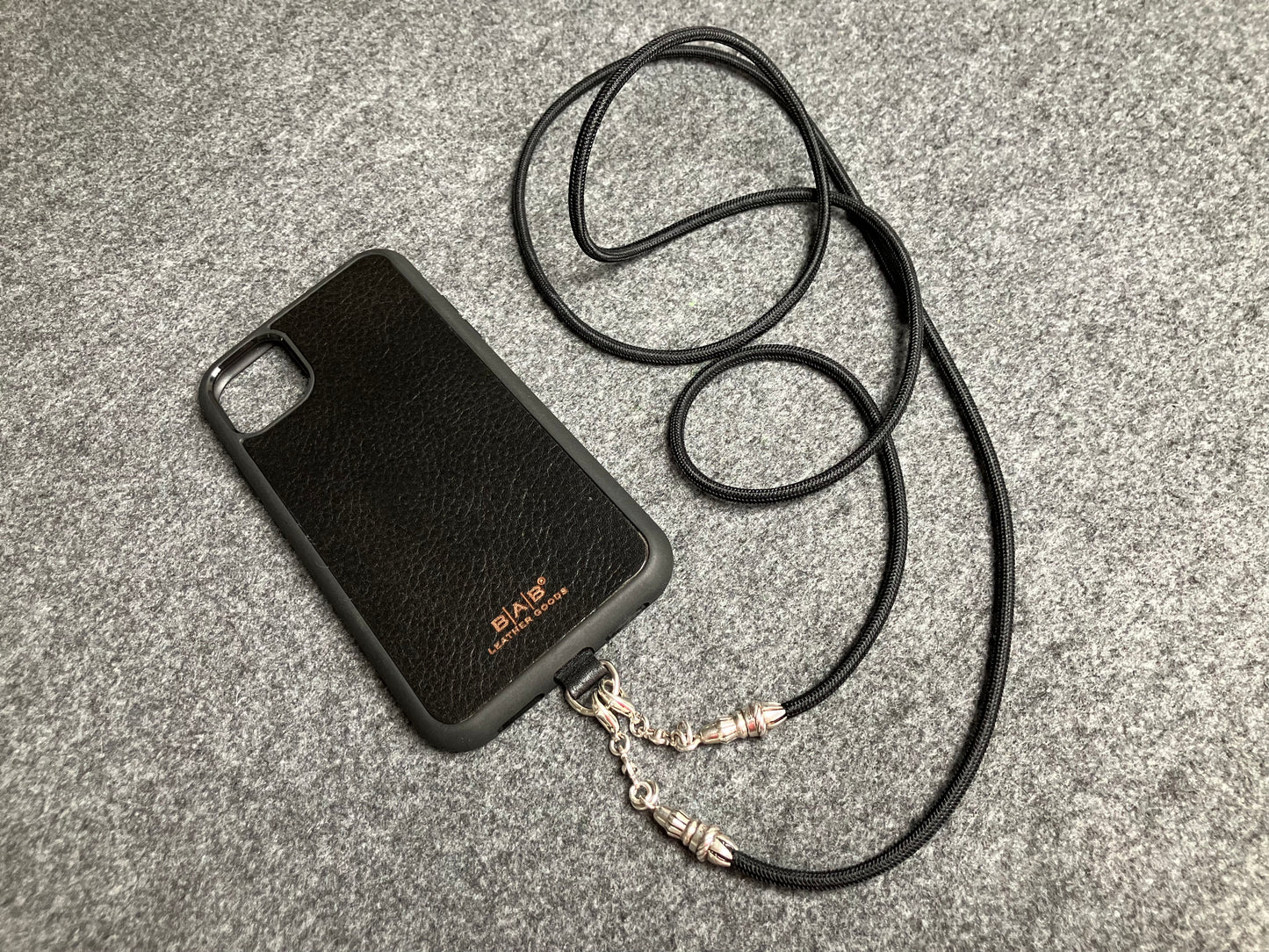 Full-Grain vegetable-tanned Genuine Leather Case/Holder for iPhone/Samsung/microfiber. 2 Rope Terminals, 2 Links, and 6 Rings, all made of 925 Sterling Silver & Crossbody/Necklace/Choker/Bracelet with Black Elastic Rope.- KC29