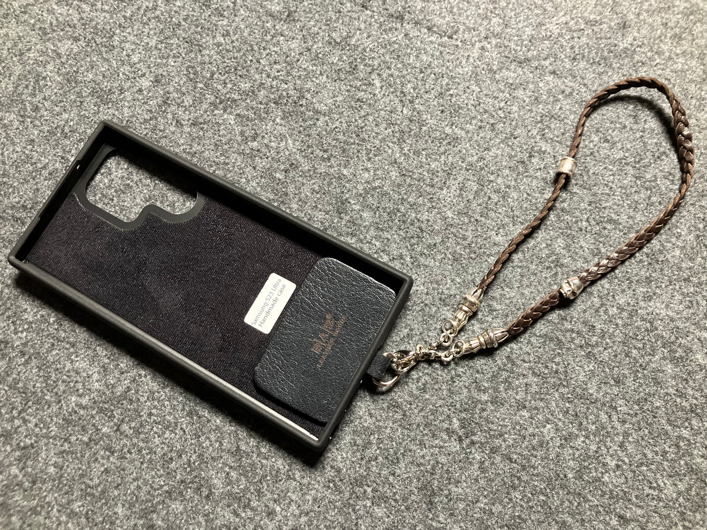 Full-Grain Genuine Leather Laser-cut & engraved Samsung Case/Holder/microfiber & 2 Terminals & 1 Rope Pin, 1 Skull, and 6 Rings, all made of 925 Sterling Silver & Strap/Choker/Bracelet, hand-braided 3-strands Leather, Brown or Black.- KP03S