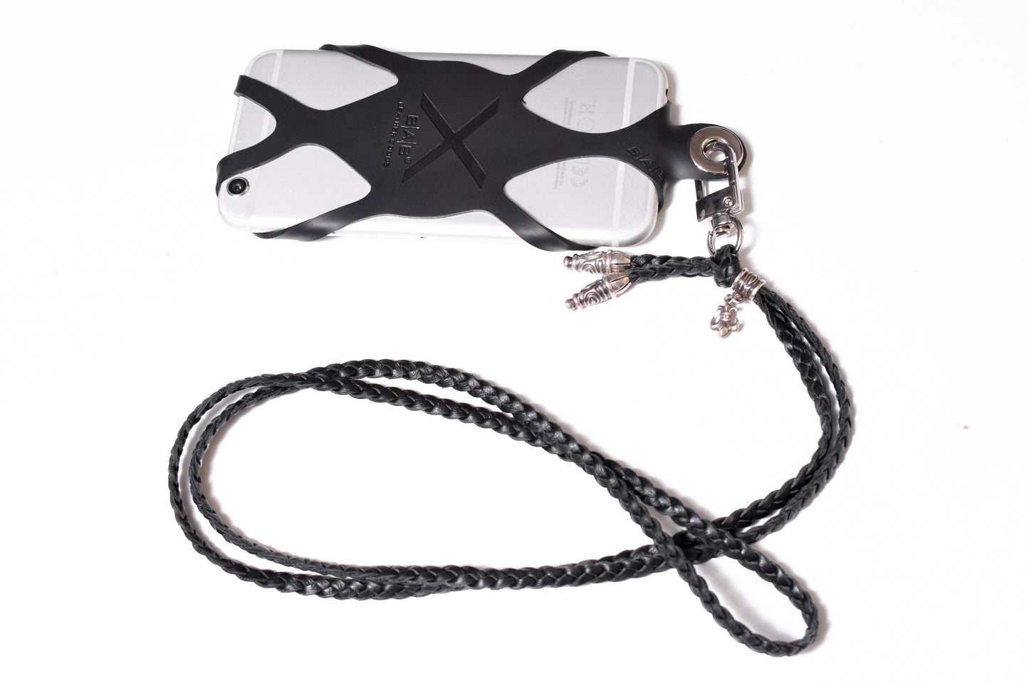 Laser-engraved Silicone cell phone Holder. 2 Spiral Terminals, 1 Spiral Pin with Ring, and 1 Fleur-de-Lys Pendant, all made of 925 Sterling Silver & Crossbody/Necklace/Bracelet with 3 hand-braided double strands, Brown, or Black.- SP45