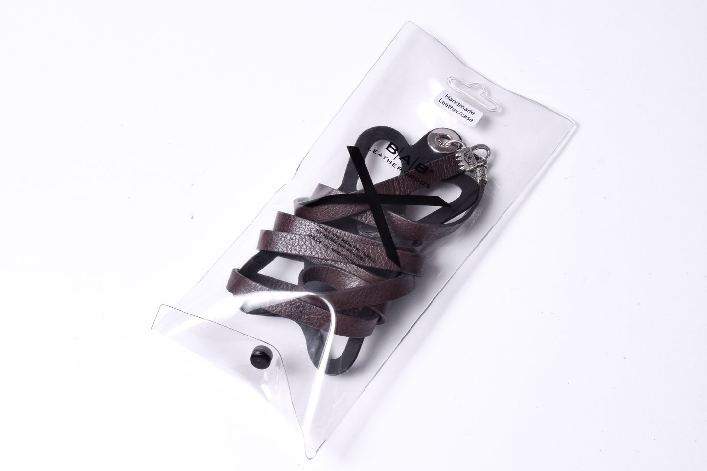 Laser-engraved Silicone cell phone Holder. 2 Cape Terminals, 1 Cane, and S-Clasp, all made of Solid 925 Sterling Silver & Crossbody/Necklace/Bracelet in double Full-Grain vegetable-tanned Leather, Blue, Brown, Black, or Red.- SP25