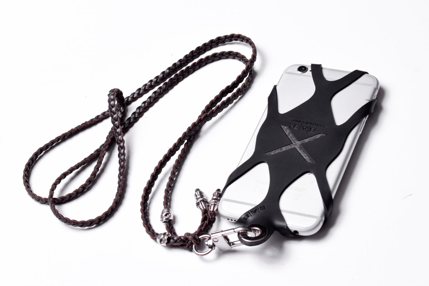 Laser-engraved Silicone cell phone Holder. 2 Skulls and 2 Rope Terminals, all made of solid 925 Sterling Silver & Genuine Leather Crossbody/Necklace/Bracelet with 3 hand-braided double strands, Brown, or Black.- SP30