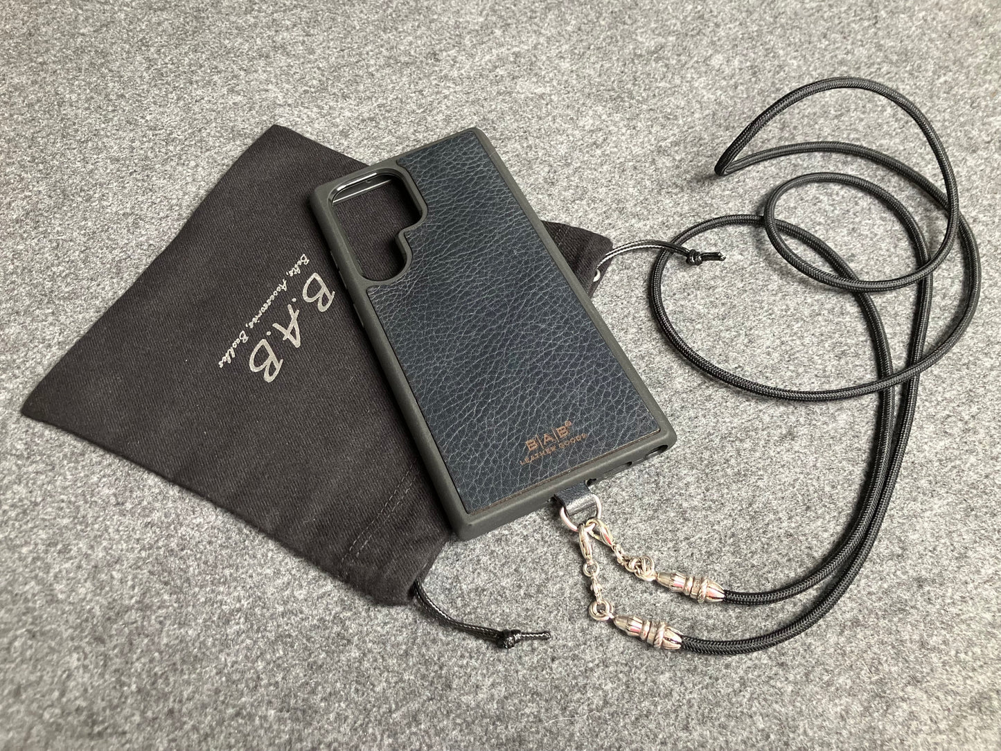 Full-Grain vegetable-tanned Genuine Leather Case/Holder for iPhone/Samsung/microfiber. 2 Rope Terminals, 2 Links, and 6 Rings, all made of 925 Sterling Silver & Crossbody/Necklace/Choker/Bracelet with Black Elastic Rope.- KC29