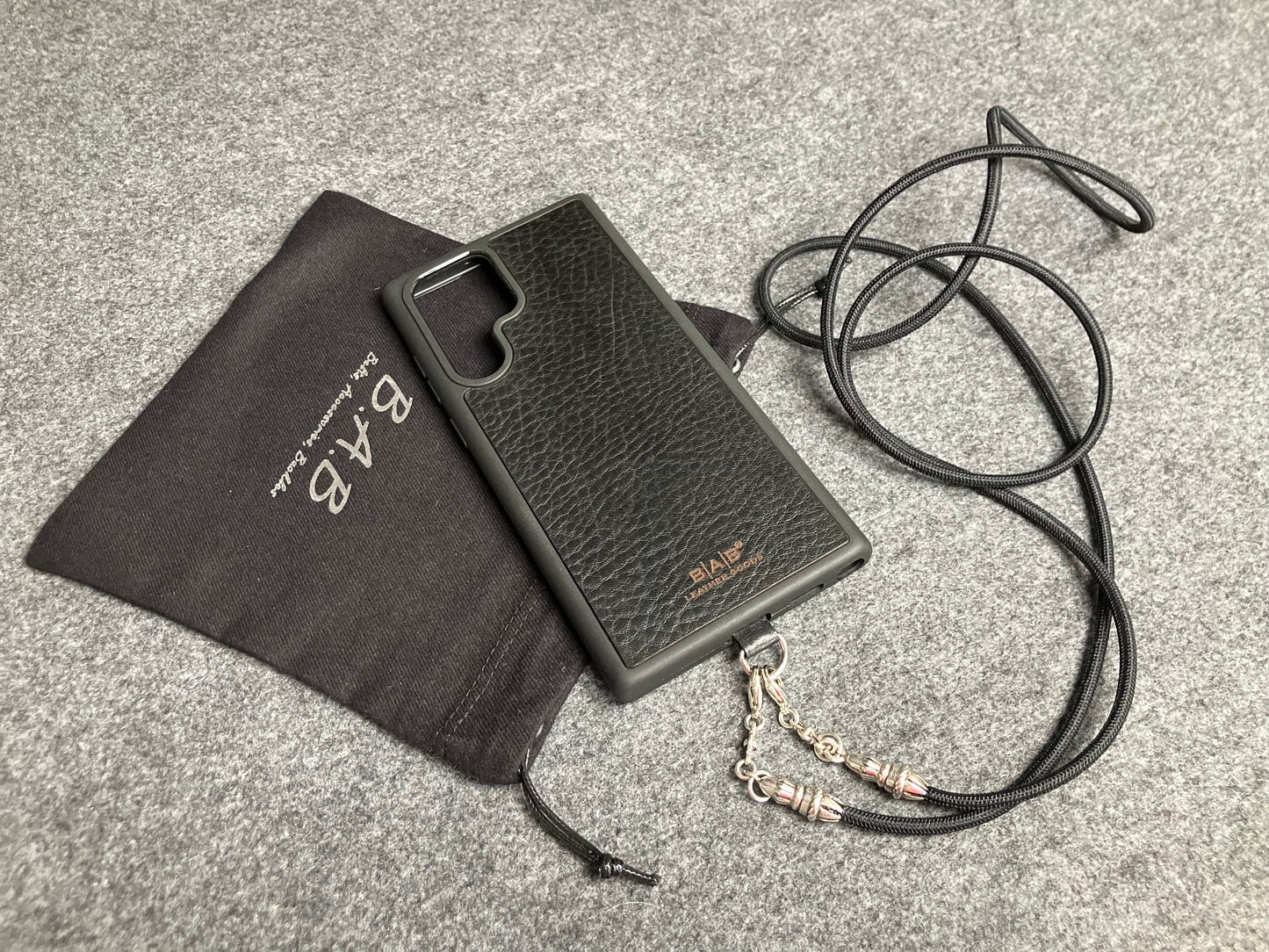 Full-Grain vegetable-tanned Genuine Leather Case/Holder for iPhone/Samsung/microfiber. 2 Rope Terminals, 2 Links, and 6 Rings, all made of 925 Sterling Silver & Crossbody/Necklace/Choker/Bracelet with Black Elastic Rope.- KC29
