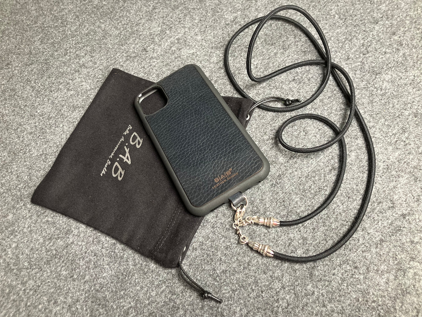 Full-Grain vegetable-tanned Genuine Leather Case/Holder for iPhone/Samsung/microfiber. 2 Rope Terminals, 2 Links, and 6 Rings, all made of 925 Sterling Silver & Crossbody/Necklace/Choker/Bracelet with Black Elastic Rope.- KC29