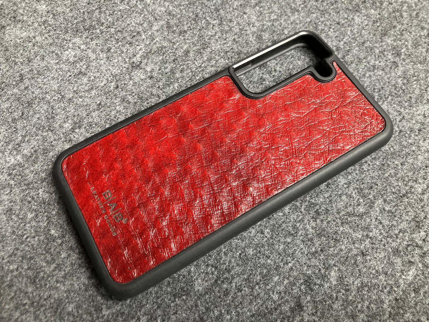 Funda de Cuero Genuino Baby Ostrich para iPhone/Samsung cortada & grabada con láser/microfibra.- 58