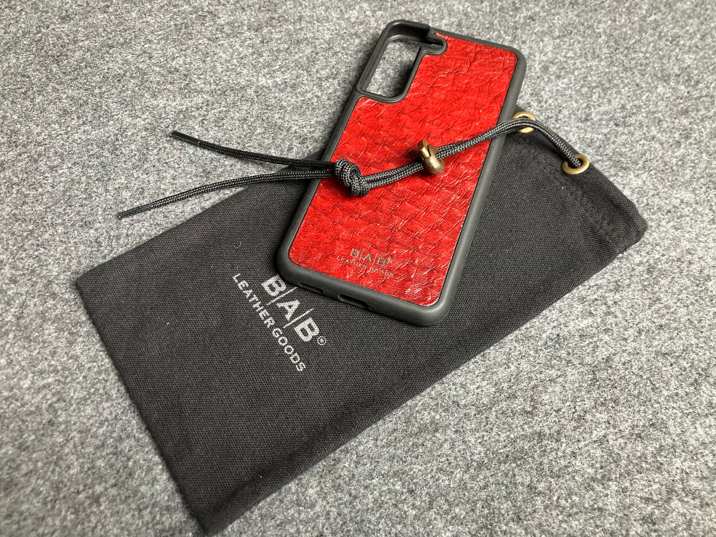 Funda de Cuero Genuino Baby Ostrich para iPhone/Samsung cortada & grabada con láser/microfibra.- 58
