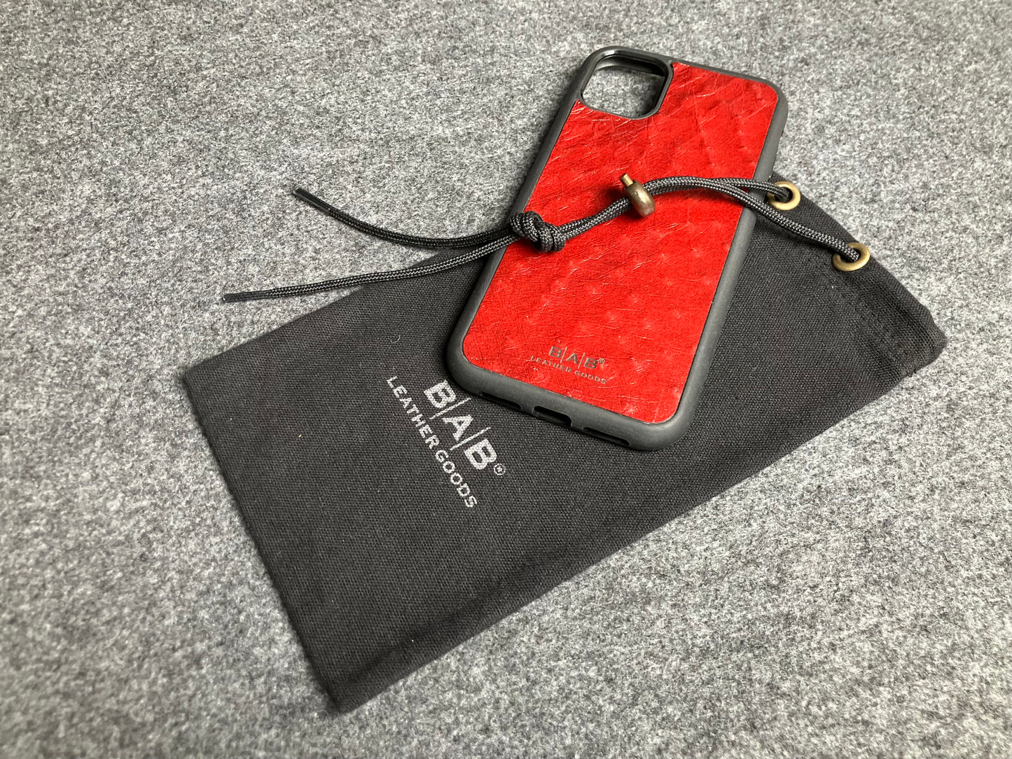 Funda de Cuero Genuino Baby Ostrich para iPhone/Samsung cortada & grabada con láser/microfibra.- 58