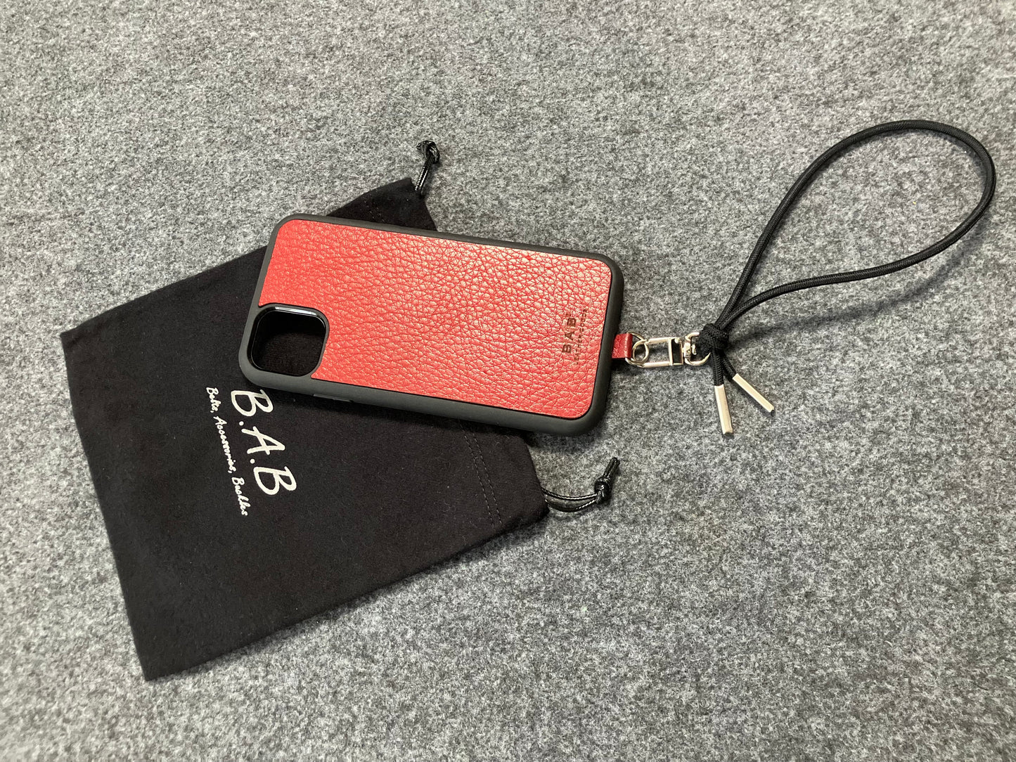 Laser-engraved Full-Grain vegetable-tanned Genuine Leather cell phone Holder & Black Elastic Rope Strap/Bracelet with a Carabiner, and 2 Silver End caps.- SP56