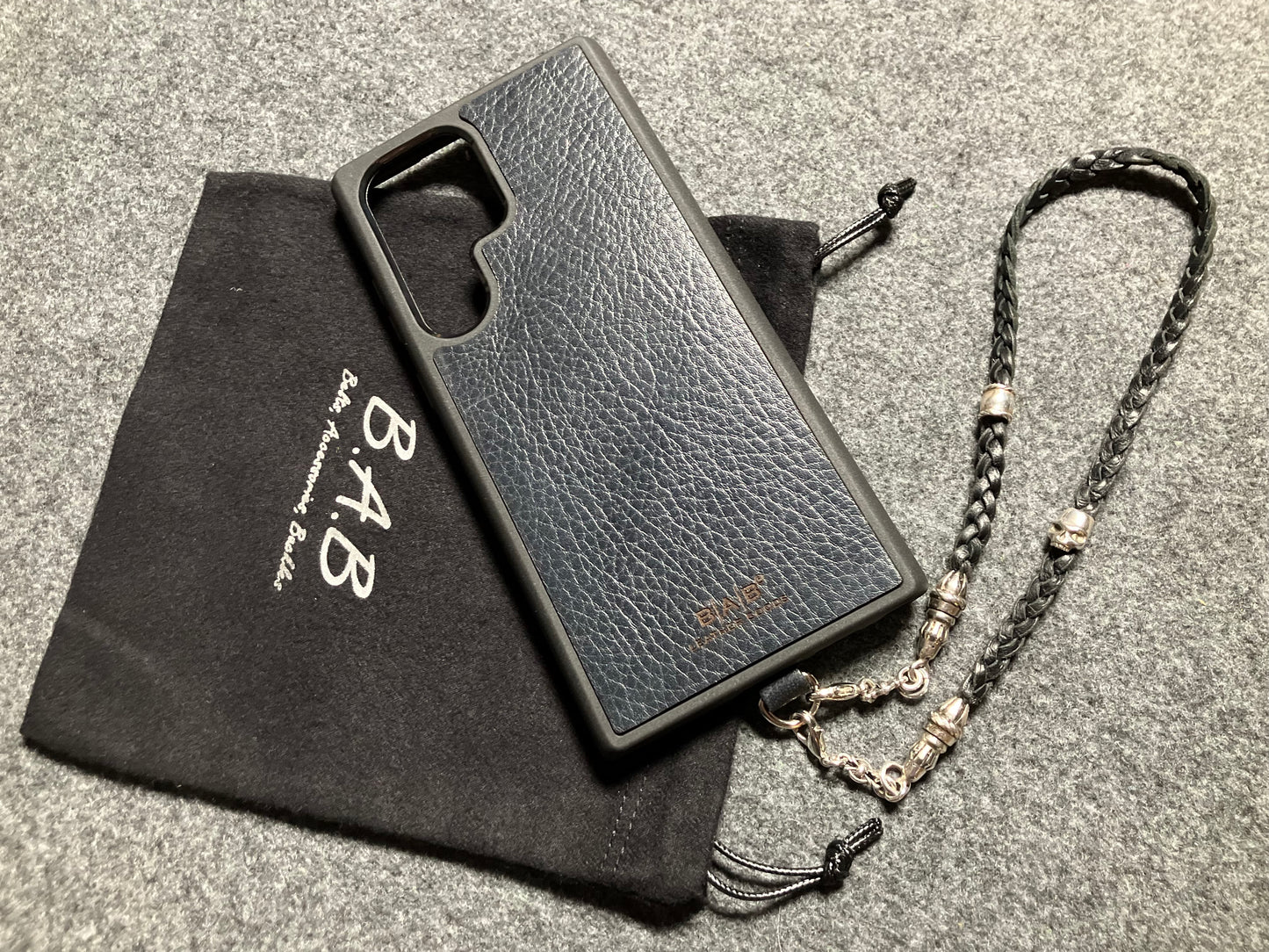 Full-Grain Genuine Leather Laser-cut & engraved Samsung Case/Holder/microfiber & 2 Terminals & 1 Rope Pin, 1 Skull, and 6 Rings, all made of 925 Sterling Silver & Strap/Choker/Bracelet, hand-braided 3-strands Leather, Brown or Black.- KP03S