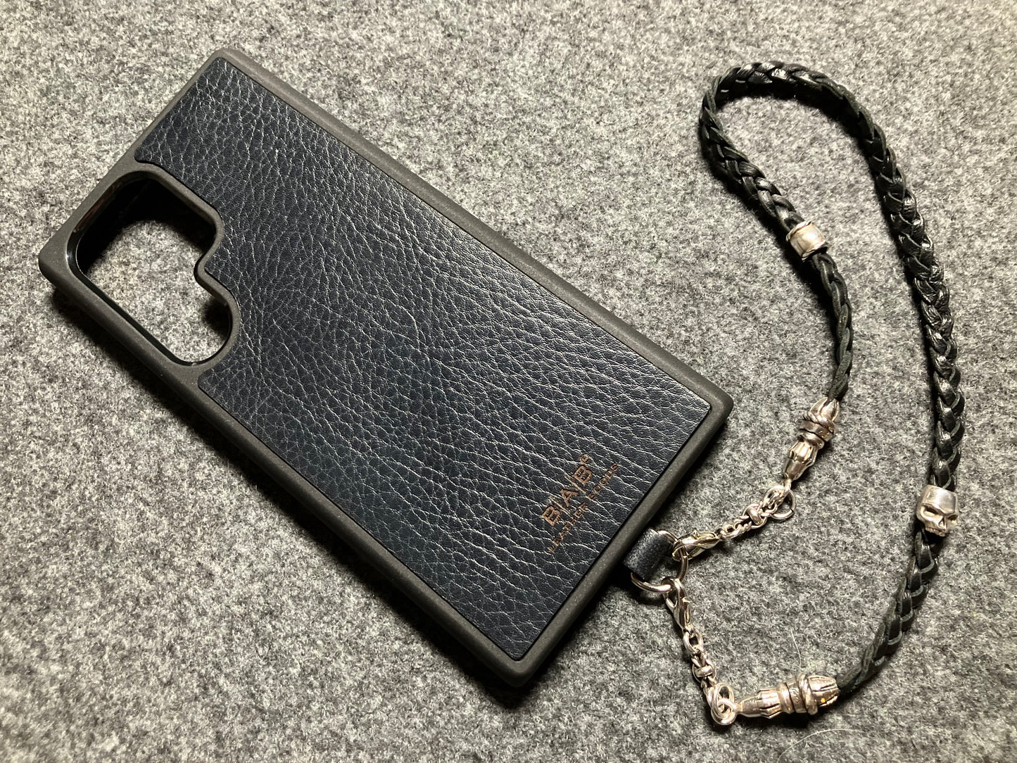 Full-Grain Genuine Leather Laser-cut & engraved Samsung Case/Holder/microfiber & 2 Terminals & 1 Rope Pin, 1 Skull, and 6 Rings, all made of 925 Sterling Silver & Strap/Choker/Bracelet, hand-braided 3-strands Leather, Brown or Black.- KP03S