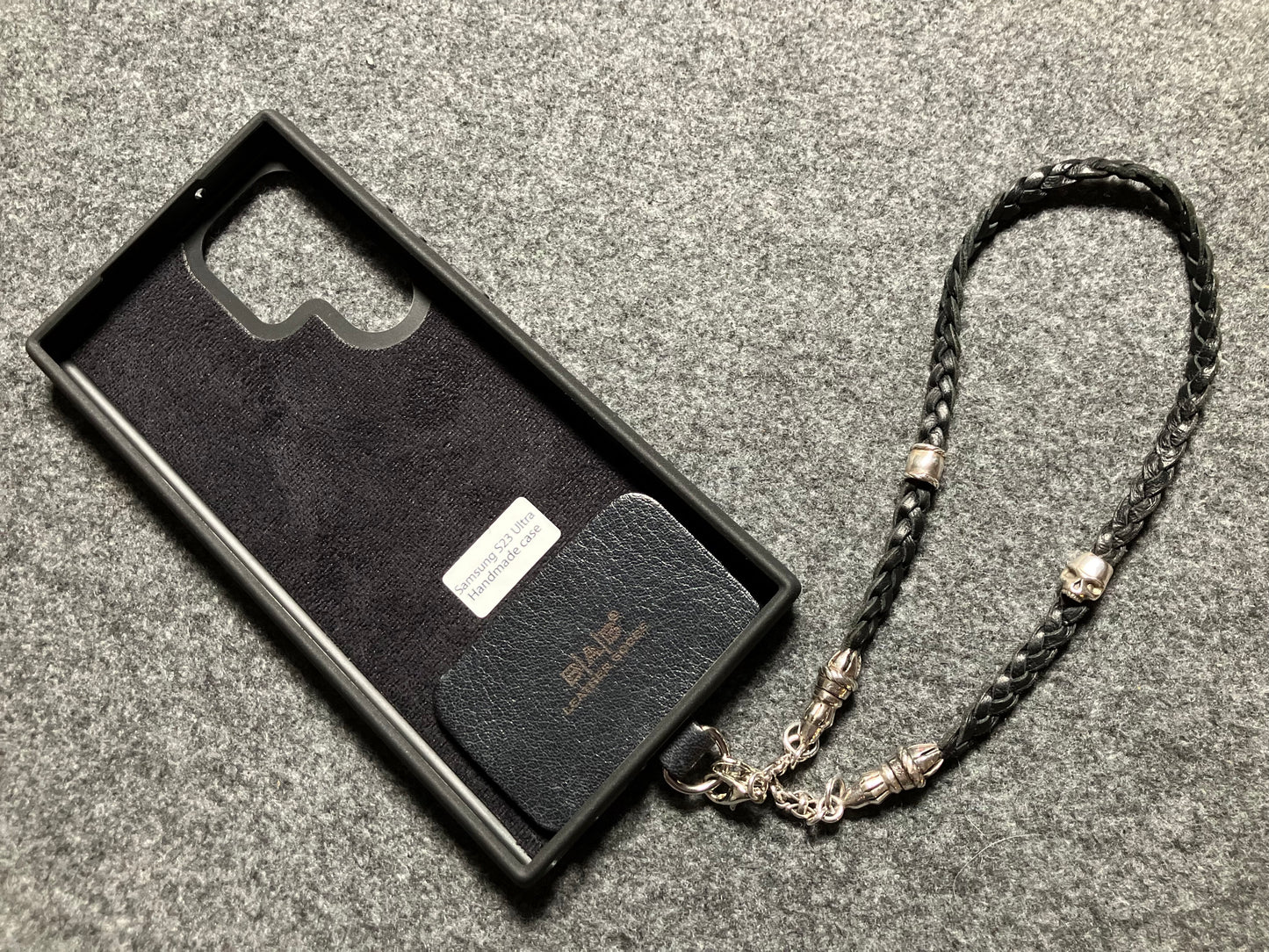 Full-Grain Genuine Leather Laser-cut & engraved Samsung Case/Holder/microfiber & 2 Terminals & 1 Rope Pin, 1 Skull, and 6 Rings, all made of 925 Sterling Silver & Strap/Choker/Bracelet, hand-braided 3-strands Leather, Brown or Black.- KP03S
