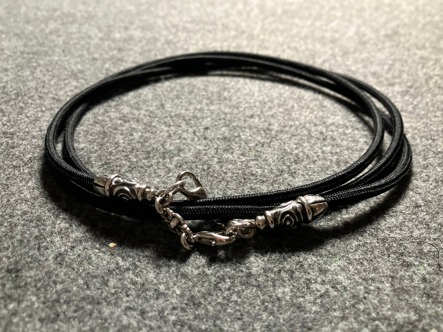 2 Spiral Terminals, 2 Links, and 6 Rings, all made of solid 925 Sterling Silver & Black Elastic Rope Crossbody/Necklace/Choker/Bracelet.- CP11