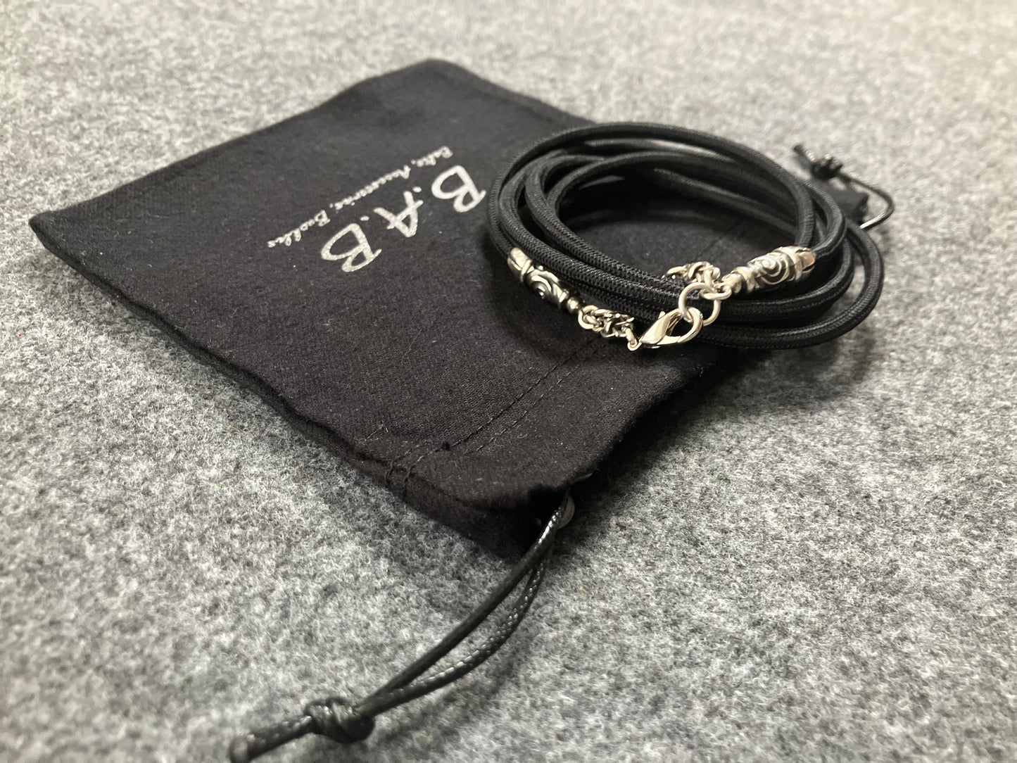 2 Spiral Terminals, 2 Links, and 6 Rings, all made of solid 925 Sterling Silver & Black Elastic Rope Crossbody/Necklace/Choker/Bracelet.- CP11