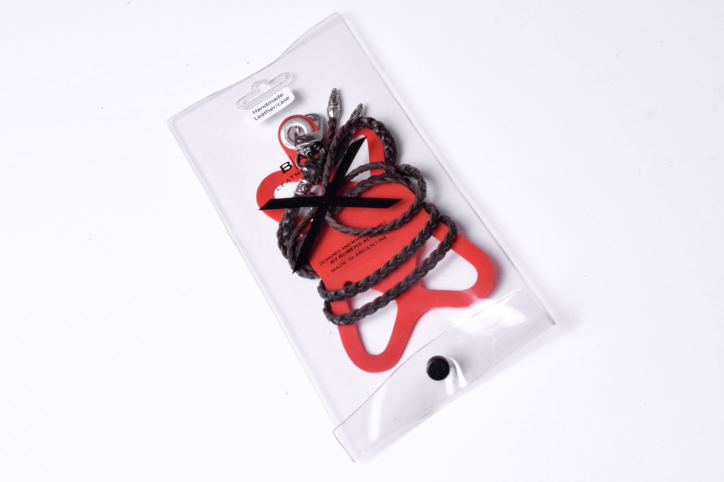 Laser-engraved Silicone cell phone Holder. 2 Spiral Terminals, 1 Spiral Pin with Ring, and 1 Fleur-de-Lys Pendant, all made of 925 Sterling Silver & Crossbody/Necklace/Bracelet with 3 hand-braided double strands, Brown, or Black.- SP45