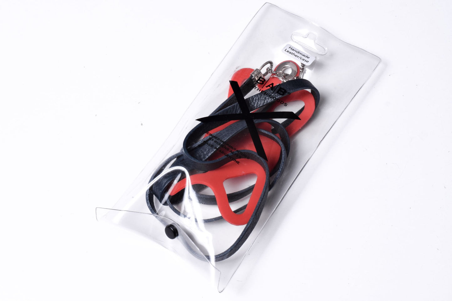 Laser-engraved Silicone cell phone Holder. 2 Cape Terminals, 1 Cane, and S-Clasp, all made of Solid 925 Sterling Silver & Crossbody/Necklace/Bracelet in double Full-Grain vegetable-tanned Leather, Blue, Brown, Black, or Red.- SP25