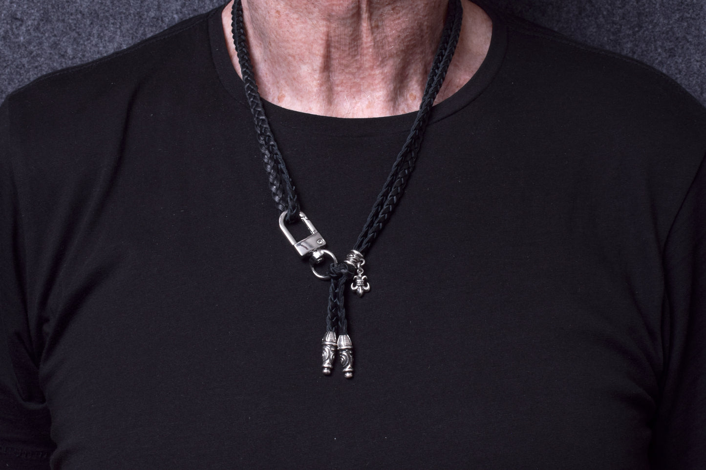 Laser-engraved Silicone cell phone Holder. 2 Spiral Terminals, 1 Spiral Pin with Ring, and 1 Fleur-de-Lys Pendant, all made of 925 Sterling Silver & Crossbody/Necklace/Bracelet with 3 hand-braided double strands, Brown, or Black.- SP45